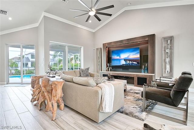 living room featuring ceiling fan, light hardwood / wood-style floors, ornamental molding, and high vaulted ceiling