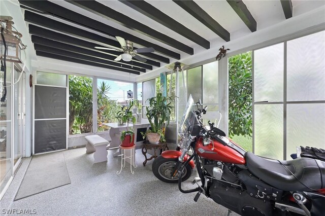 sunroom / solarium with a wealth of natural light and ceiling fan