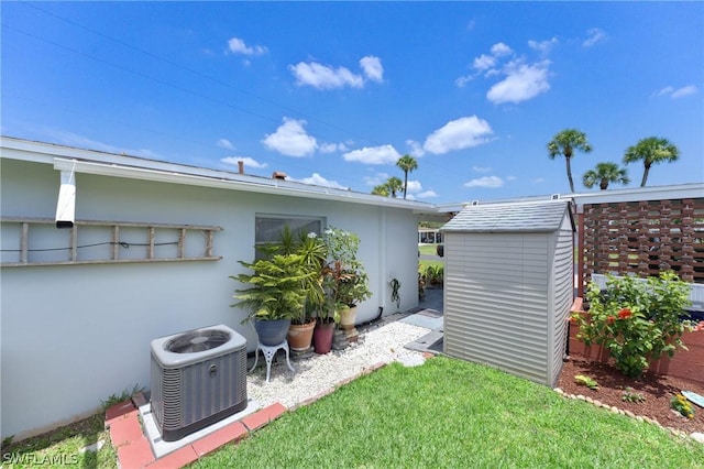 view of yard with a storage unit and cooling unit