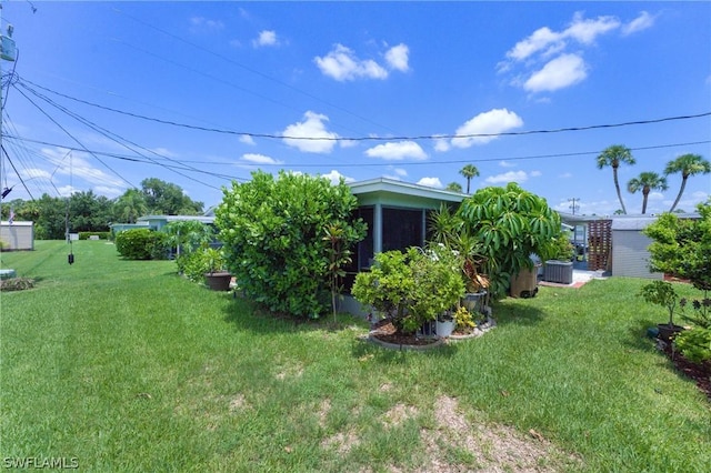 view of yard featuring central AC unit