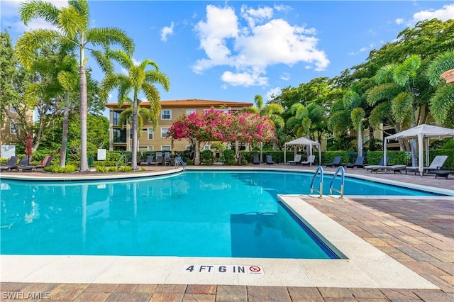 view of pool with a gazebo and a patio