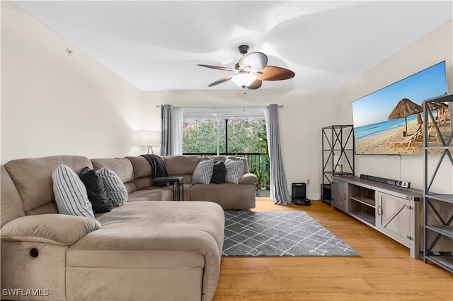 living room with hardwood / wood-style floors and ceiling fan