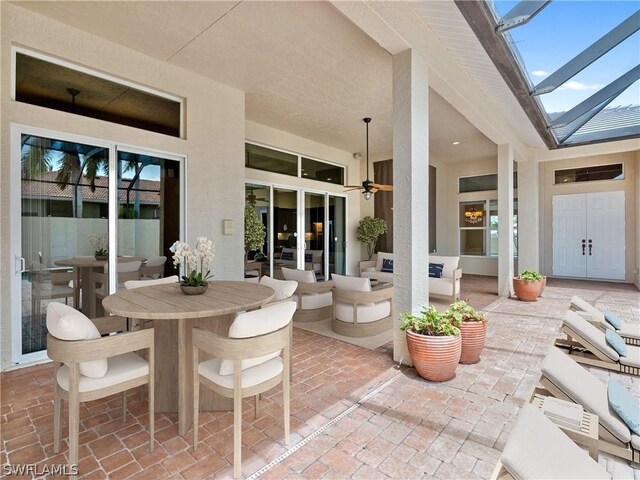 view of patio featuring ceiling fan