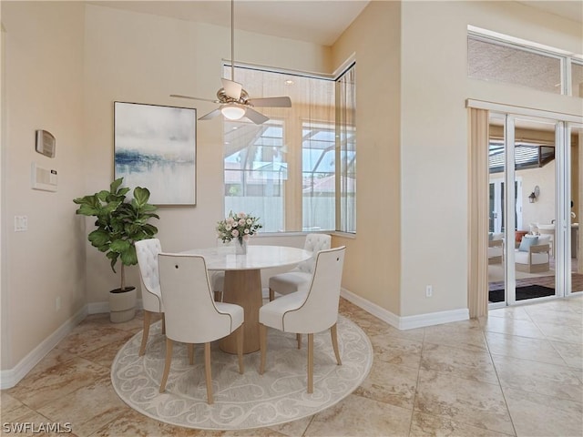 dining space featuring ceiling fan