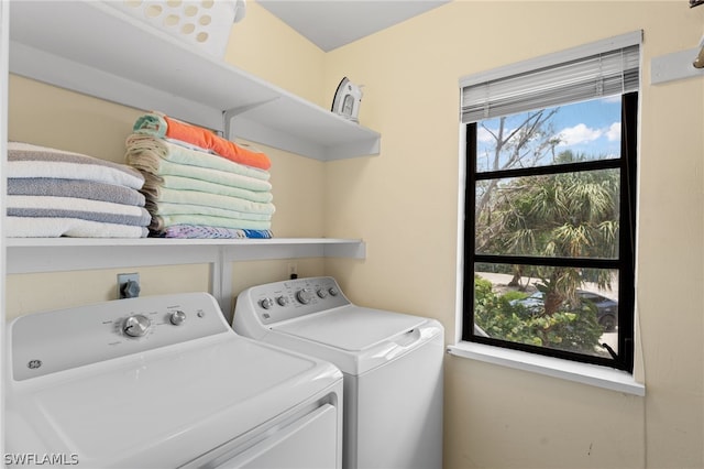 laundry room with washing machine and dryer