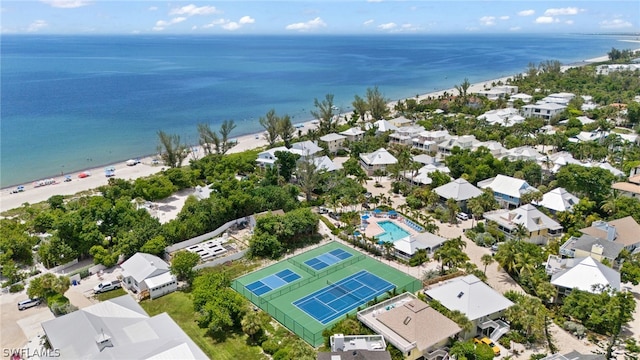 birds eye view of property with a view of the beach and a water view