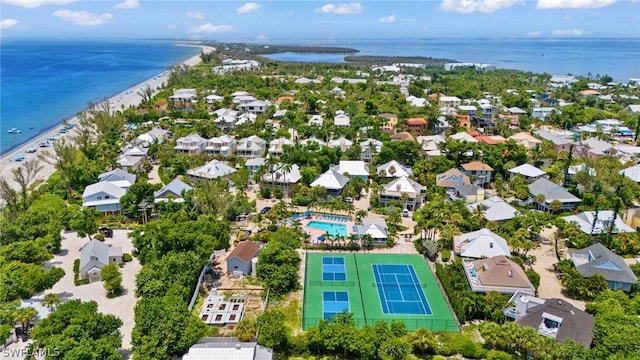 bird's eye view featuring a water view and a view of the beach