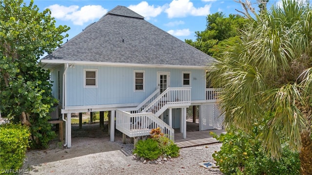 rear view of house with a carport