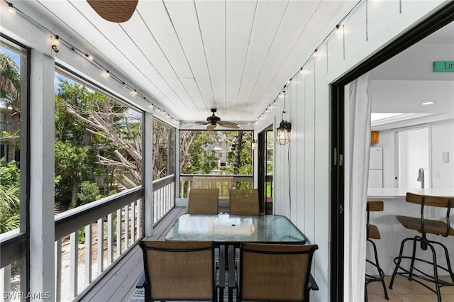 sunroom / solarium with ceiling fan