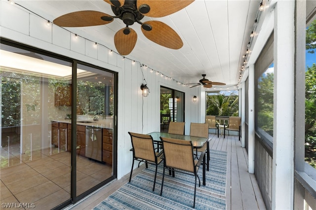 sunroom featuring a wealth of natural light and ceiling fan