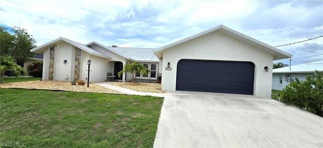 ranch-style house with a garage and a front yard