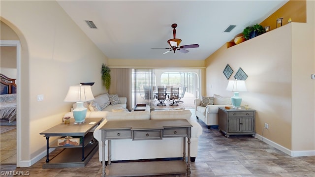 living room with lofted ceiling and ceiling fan