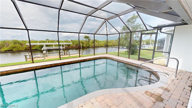 view of pool with a lanai, a patio area, a boat dock, and a water view