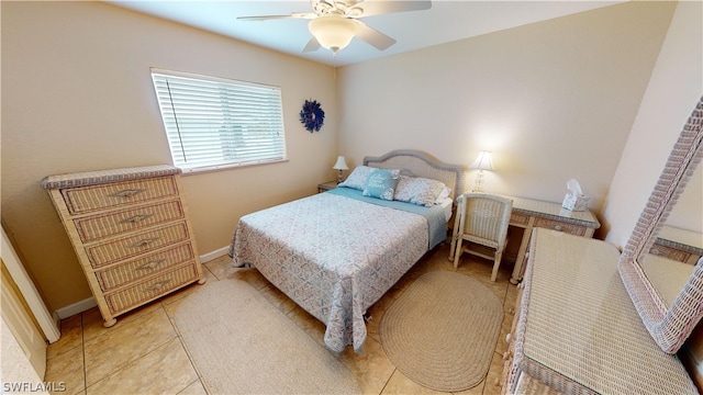 bedroom featuring light tile patterned flooring and ceiling fan