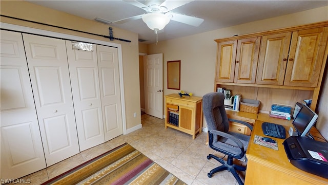 home office featuring ceiling fan and light tile patterned floors