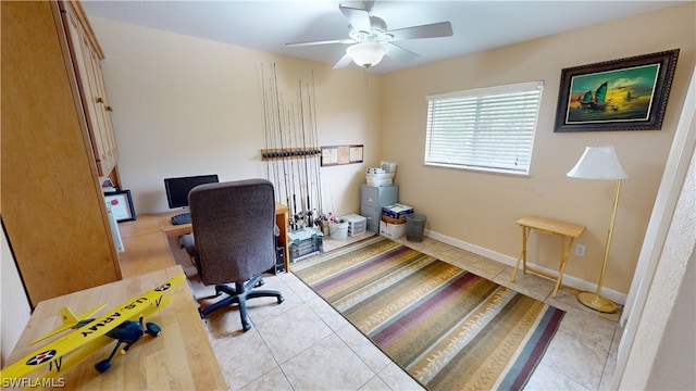 office area featuring light tile patterned floors and ceiling fan