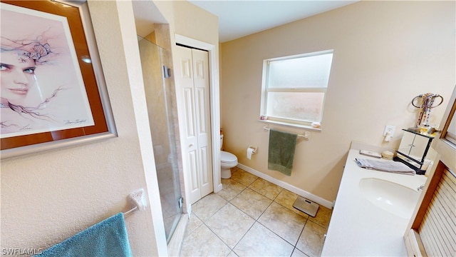 bathroom with walk in shower, tile patterned floors, vanity, and toilet