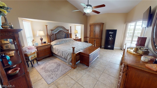 tiled bedroom featuring lofted ceiling and ceiling fan