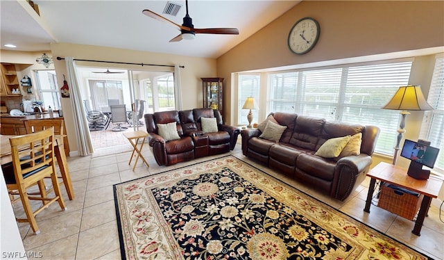 living room featuring light tile patterned flooring, lofted ceiling, and ceiling fan