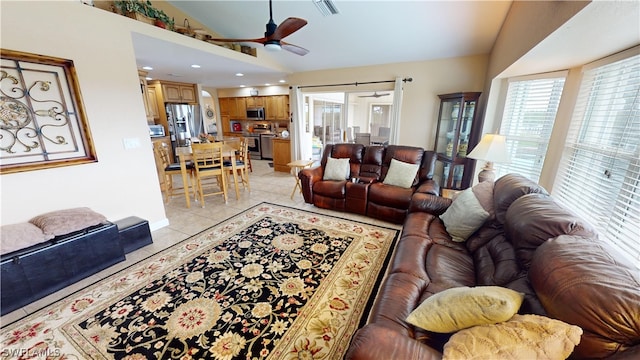 tiled living room with vaulted ceiling and ceiling fan