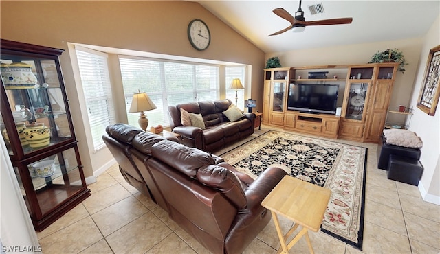 tiled living room with ceiling fan and lofted ceiling