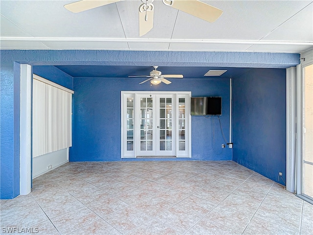 interior space with ceiling fan