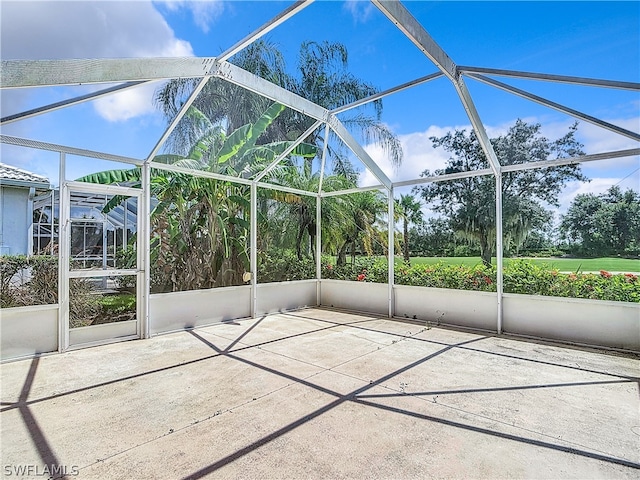 unfurnished sunroom with vaulted ceiling