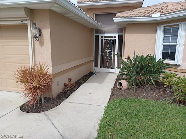 entrance to property featuring a garage