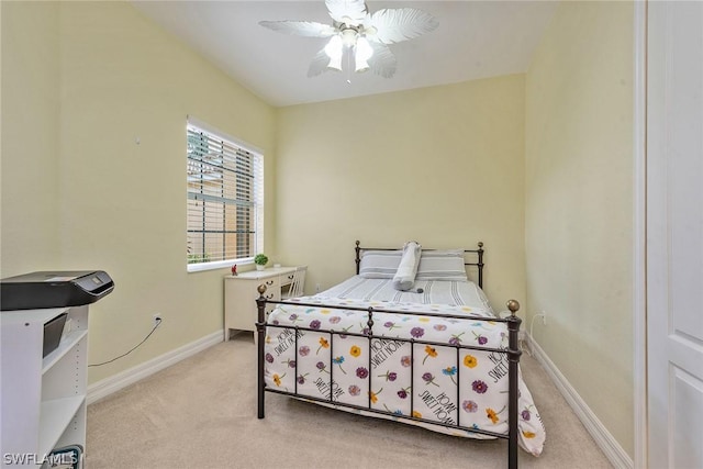 bedroom with ceiling fan and light colored carpet