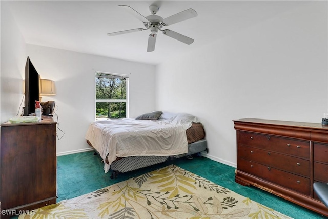 bedroom with dark carpet and ceiling fan