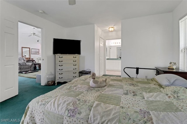 carpeted bedroom featuring ensuite bathroom and ceiling fan