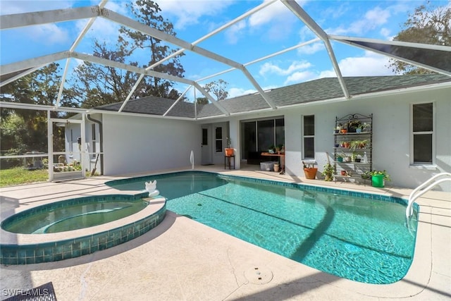 view of swimming pool with an in ground hot tub, a patio, and glass enclosure