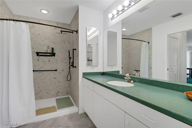 bathroom featuring vanity and walk in shower