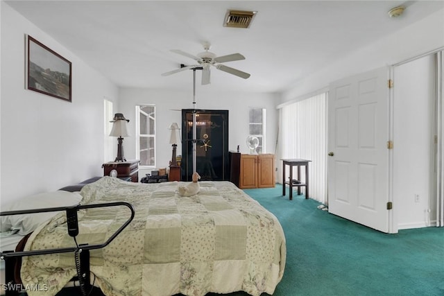 carpeted bedroom with ceiling fan