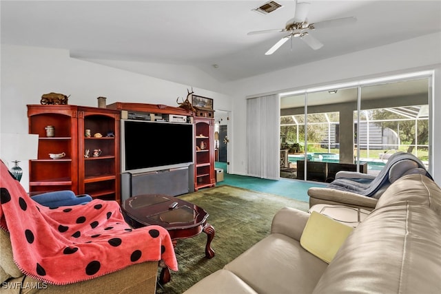 living room featuring carpet floors, vaulted ceiling, and ceiling fan