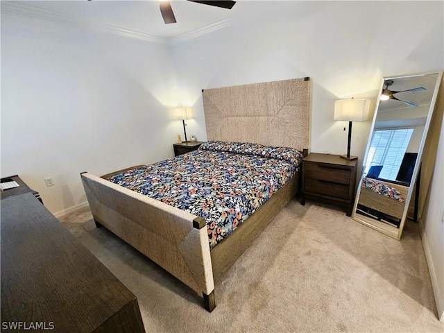 carpeted bedroom with ceiling fan and crown molding