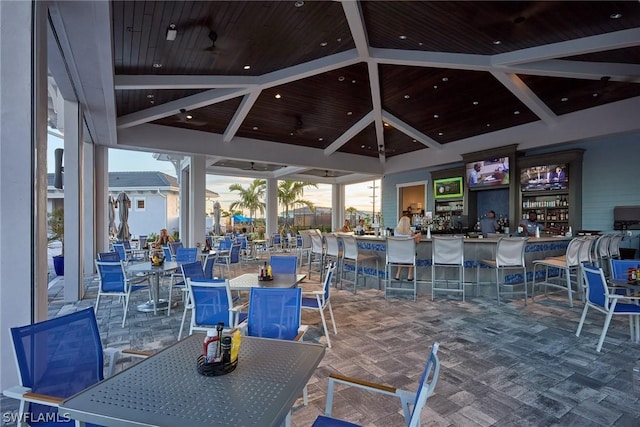 view of patio / terrace with a gazebo, a bar, and ceiling fan