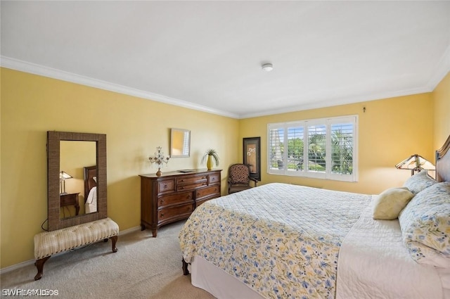 bedroom featuring carpet floors, baseboards, and ornamental molding