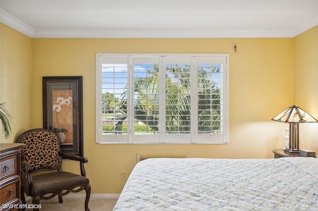 carpeted bedroom with baseboards and crown molding