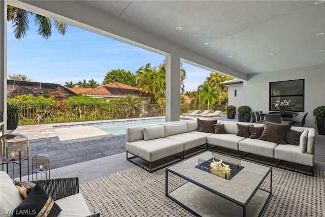 view of patio featuring outdoor lounge area and a fenced in pool