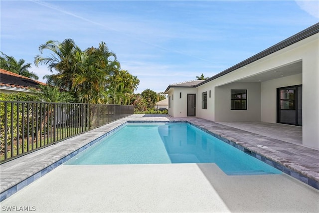 view of swimming pool with a patio area