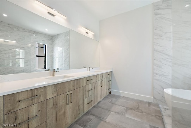 bathroom with vanity and a bathing tub