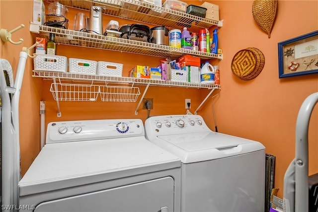 washroom with separate washer and dryer