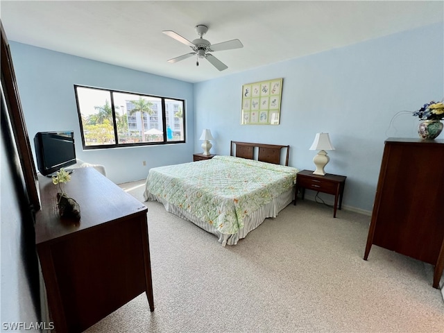 bedroom with light colored carpet and ceiling fan