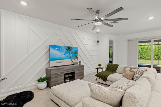 tiled living room with ceiling fan