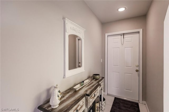 doorway to outside featuring light tile patterned floors