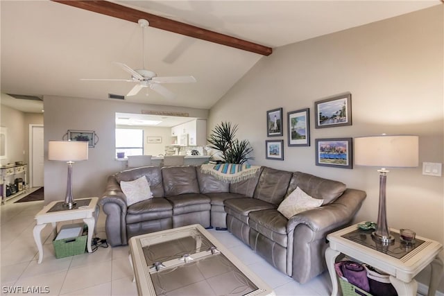 living room with ceiling fan, light tile patterned floors, and lofted ceiling with beams