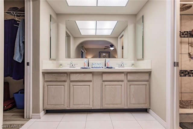 bathroom with a shower, tile patterned flooring, vanity, and ceiling fan