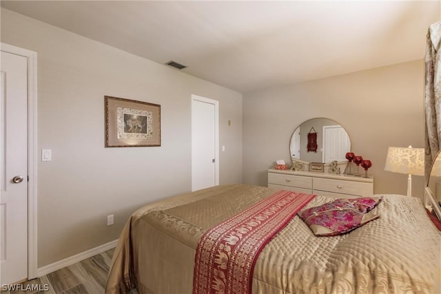 bedroom featuring hardwood / wood-style flooring