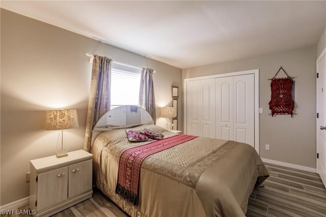 bedroom with wood-type flooring and a closet